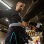 Tying Belt at Team Taino Martial Arts