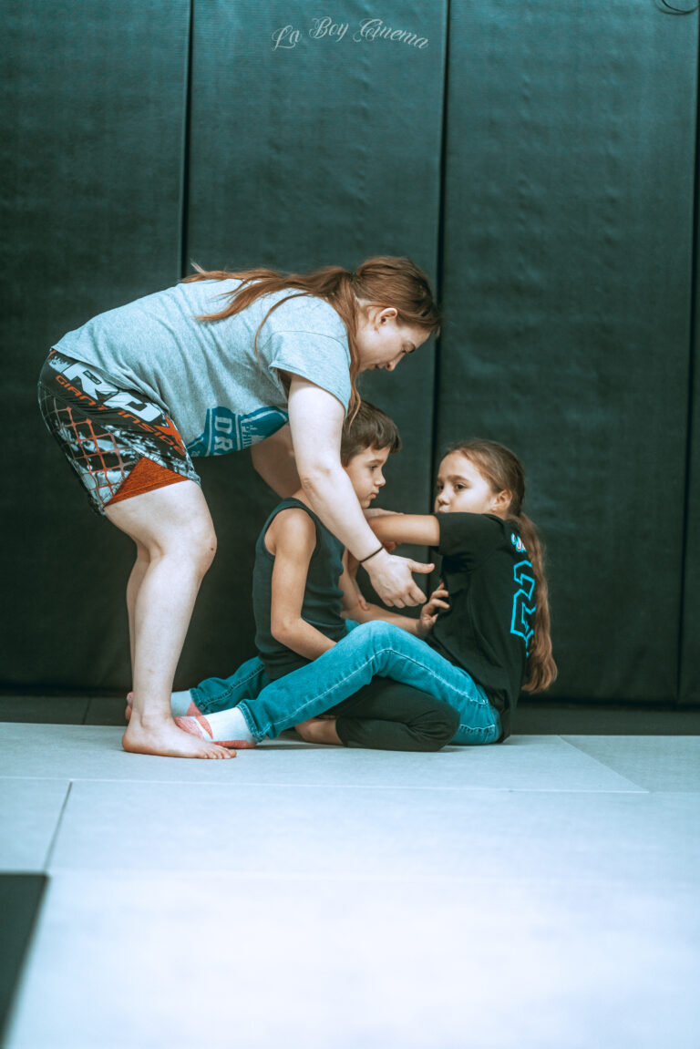 Taylor teaching kids at Team Taino Martial Arts