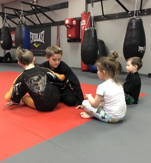 Little Kids learning from older kids how to grappel